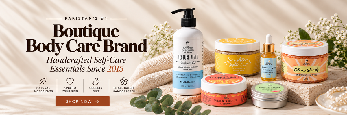 A promotional banner for 'Boutique Body Care Brand' showcasing a collection of handcrafted self-care products, including a white pump bottle, yellow and orange jars, and small metal tins, arranged on a beige fabric background with decorative props like a knitted scarf, eucalyptus leaves, and dried flowers.